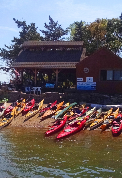 Colorful kayaks and education pavilion at the Outer Island Unit, Branford