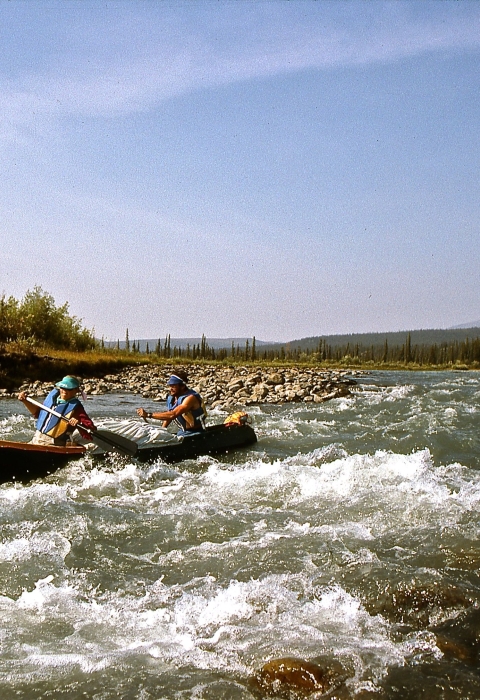 Paddlers navigate rapids on Alaska’s Sheenjek River