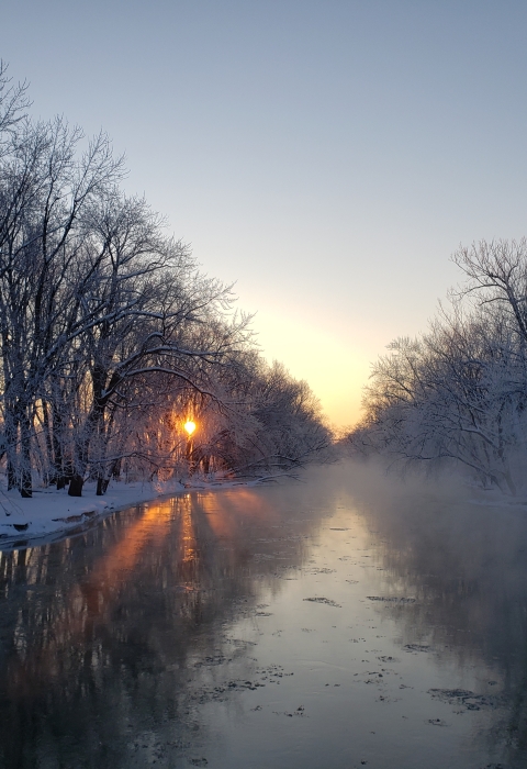 Sunrise at the Trempealeau River during a snow day 