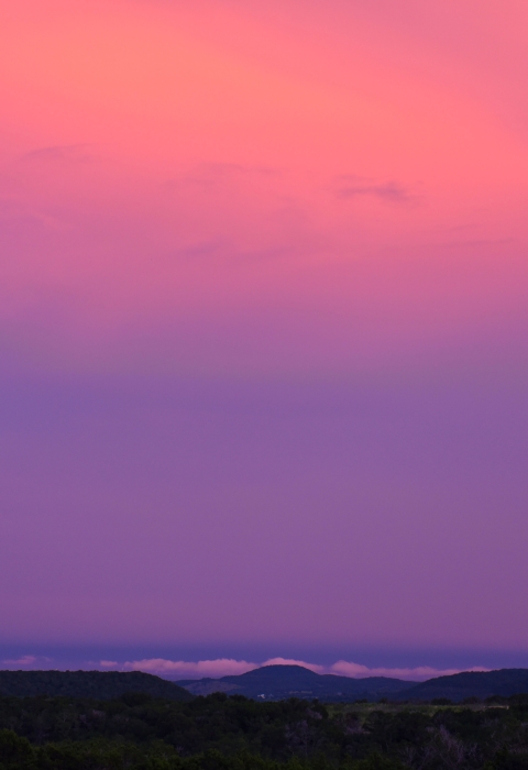 the sky glows pink and purple at sunset