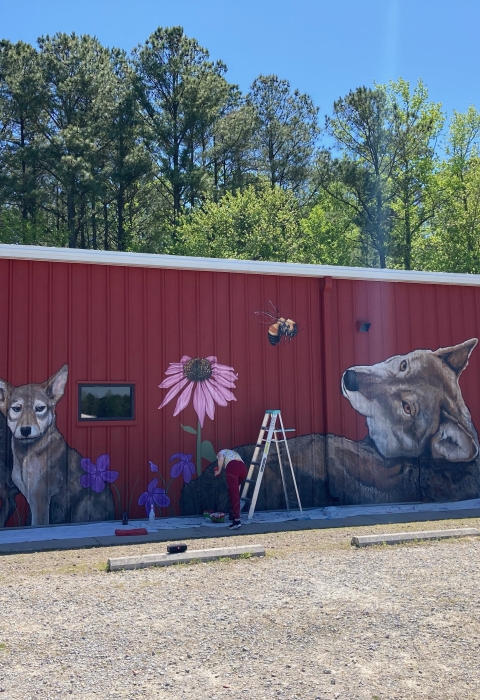 a large red building with animals on it