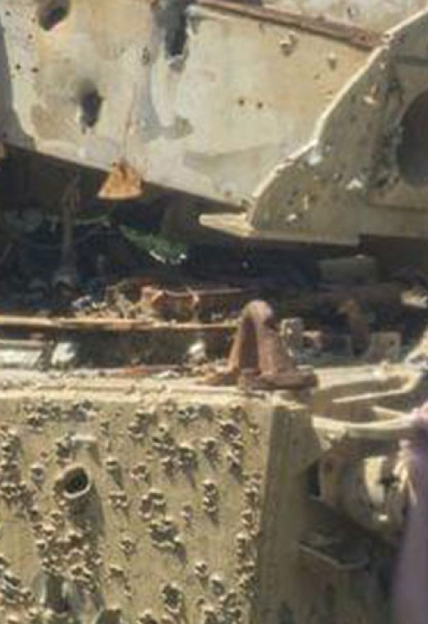 A tank littered with bullet holes at Townsend bombing range.