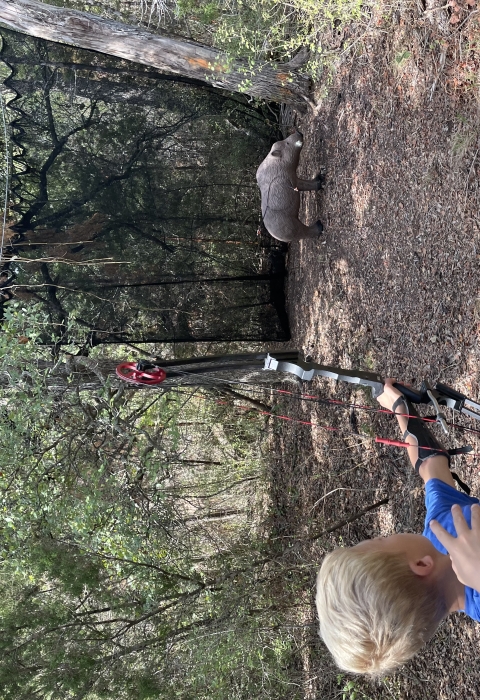 5th grade student using the 3D archery course at Inks Dam NFH