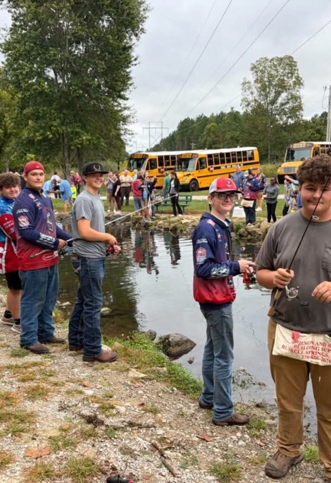 Boys fishing stream