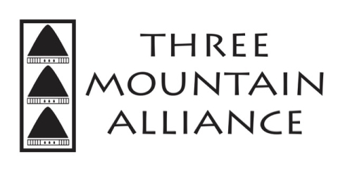 White rectangle with three black triangles on the left side stacked in a line, beside them to the right are the words Three Mountain Alliance