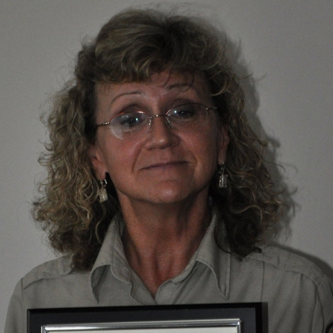 An image of a staff member smiling.