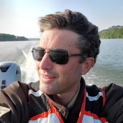 Michael Schramm piloting a boat