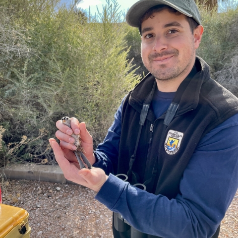 Picture of man holding bird