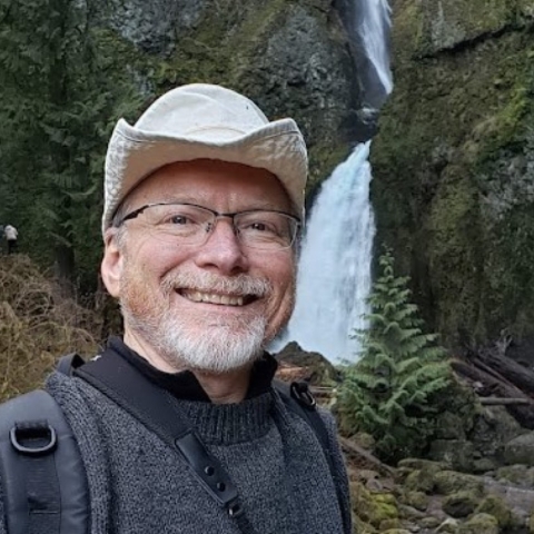 Photo of Michael Green in front of waterfall