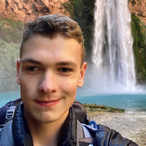 Cole near a waterfall