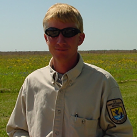 Darrell Peterson in his Service uniform and sunglasses. Image from The Boomer by the Friends of Attwater Prairie Chicken Refuge