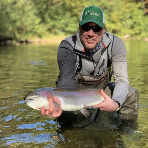Matt Filsinger holding large trout. 