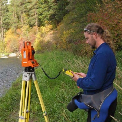 David Hines, Geographer at the CRFWCO, working with surveyor equipment