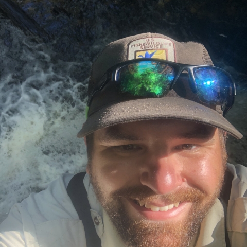 Richard Peek on top of a waterfall