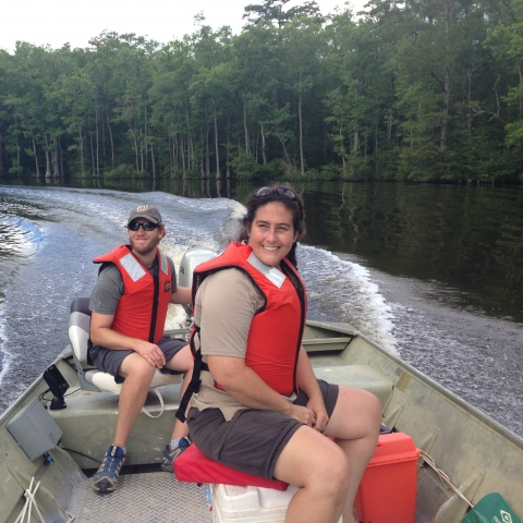 Two biologists on a boat on the Nottoway River, Virginia.