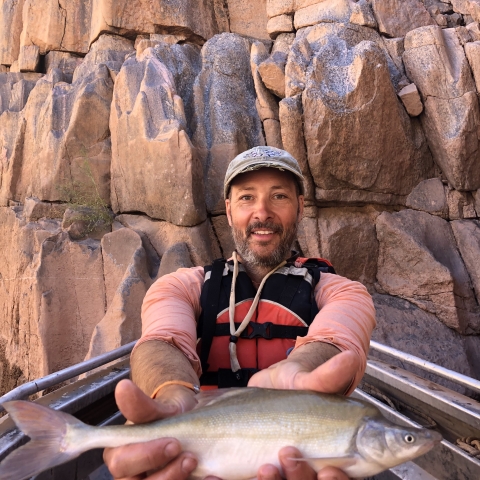 Dan Leavitt holding a Humpback Chub in the Grand Canyon of the Colorado River