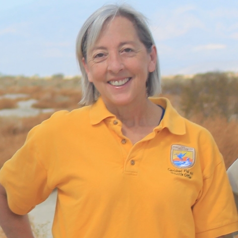 Image of Jane Hendron wearing a gold colored polo shirt
