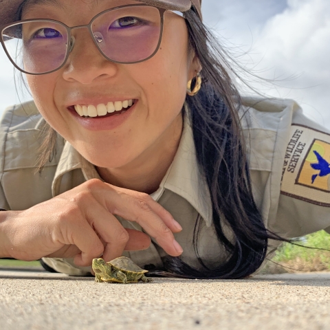 Jessica Jia, park ranger, with red-eared slider turtle