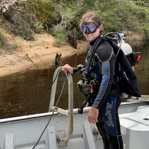Bill Tate in SCUBA gear surveying for freshwater mussels