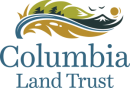 A logo with tree, mountain, and river artwork with the words "Columbia Land Trust"