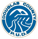 Round logo in blue with a graphic image of mountains in background, dam across middle, and sweeping lines of river in foreground