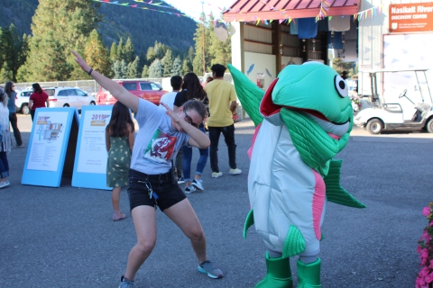 Festival volunteer and salmon mascot 