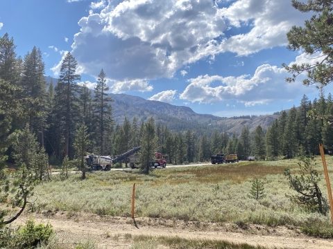photo of construction on Yosemite toad road including trucks and heavy equipment