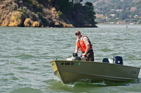 A law enforcement patrolling a waterway on boat