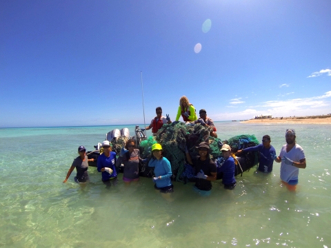 NOAA team removes old nets from coral at Papahanamokuakea Marine National Monument.