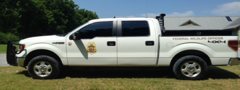 A white Law Enforcement truck with the official USFWS logo