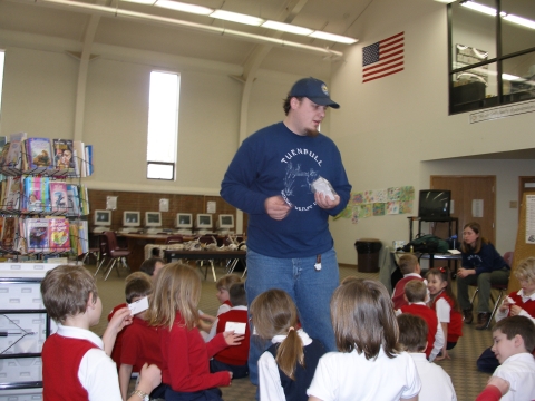 A volunteer from Turnbull NWR, presenting a winter outreach program off refuge for a group of students.