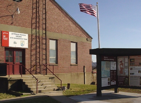 Outside view of brick office building and kiosk at Big Oaks NWR
