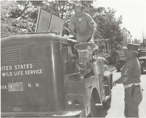 Unloading fish with the help of an Air Force master sergeant