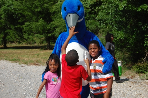 Blue Goose interacting with children