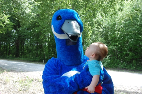 Blue Goose holding a baby