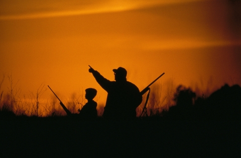 An experienced hunter mentors a youth hunter.