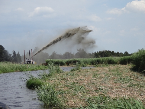 An image of a dredge at work in a marsh