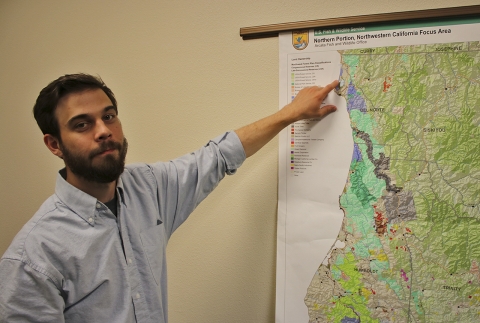 a man pointing at a map of northern California
