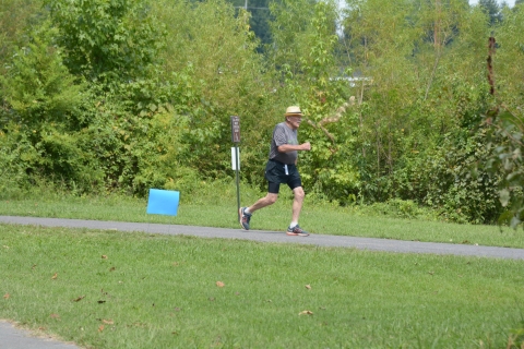 A person running on a trail.