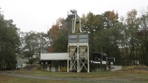 Tractor trailer delivery feed to a storage bin.