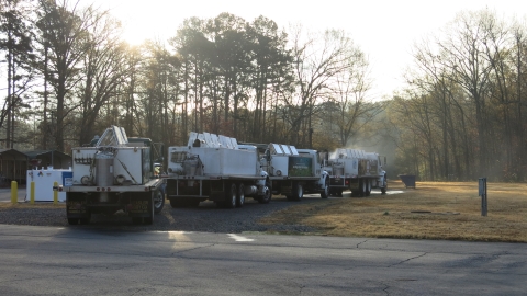 four distribution trucks being disinfected.