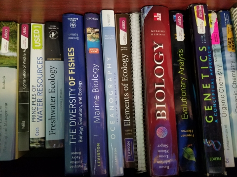 Science books on a bookshelf