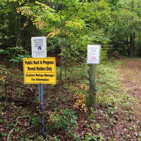 Law enforcement signs, including yellow permit holders only