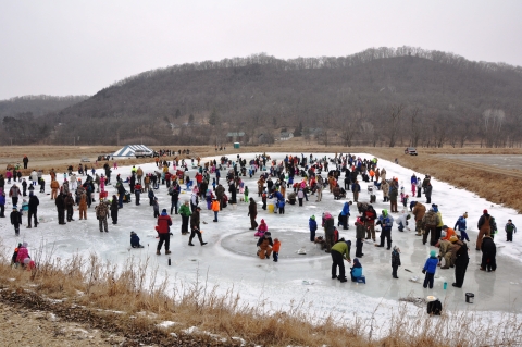 A large group of people ice fishing