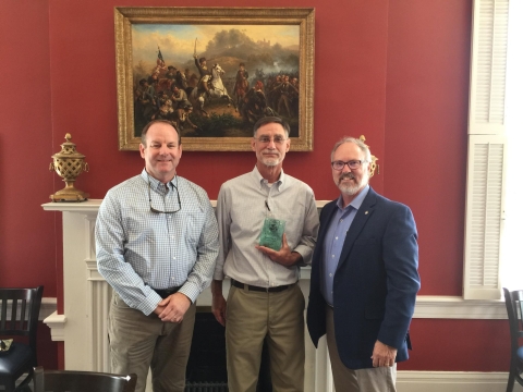 Jeff Powell, Pat O'Neil and Bill Pearson honor the work of O'Neil