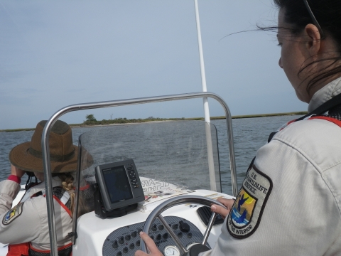 US Fish Wildlife staff on boat