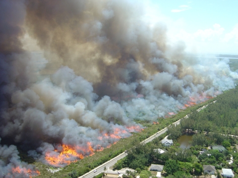Smoke from a controlled burn blows away from homes at Florida’s J.N. “Ding” Darling National Wildlife Refuge. 