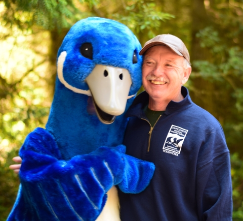 The Refuge System's Blue Goose Poses With A Refuge Volunteer