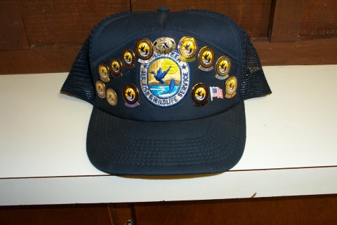 image of a volunteer hat covered with award pins