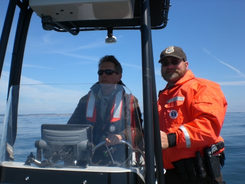 Two Wildlife Officers Patrol Refuge Waters by Boat